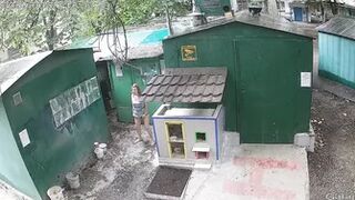 CCTV behind garages caught pissing woman