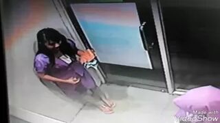 Beautiful Girl Wetting Herself in ATM Room