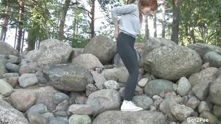 Redhead On The Rocks