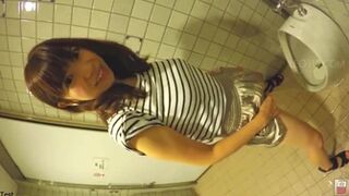 Japanese girl misses the urinal