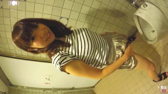 Japanese girl misses the urinal