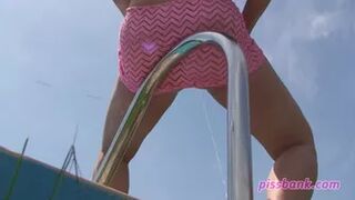 Pissing Lady at the pool