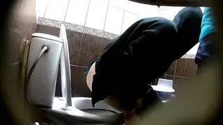 two girls- one of them pees