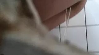 young lady pees and wipes