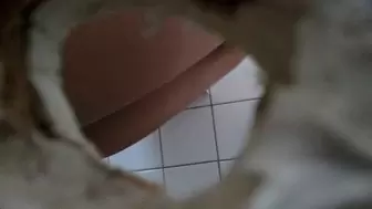 young lady pees and wipes