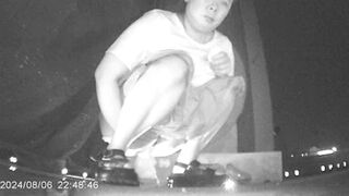 Desperate Chinese girl peeing in a hidden corner of a night market with no toilet