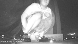 Desperate Chinese girl peeing in a hidden corner of a night market with no toilet