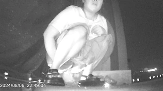 Desperate Chinese girl peeing in a hidden corner of a night market with no toilet