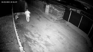CCTV - She pissing under our fence!